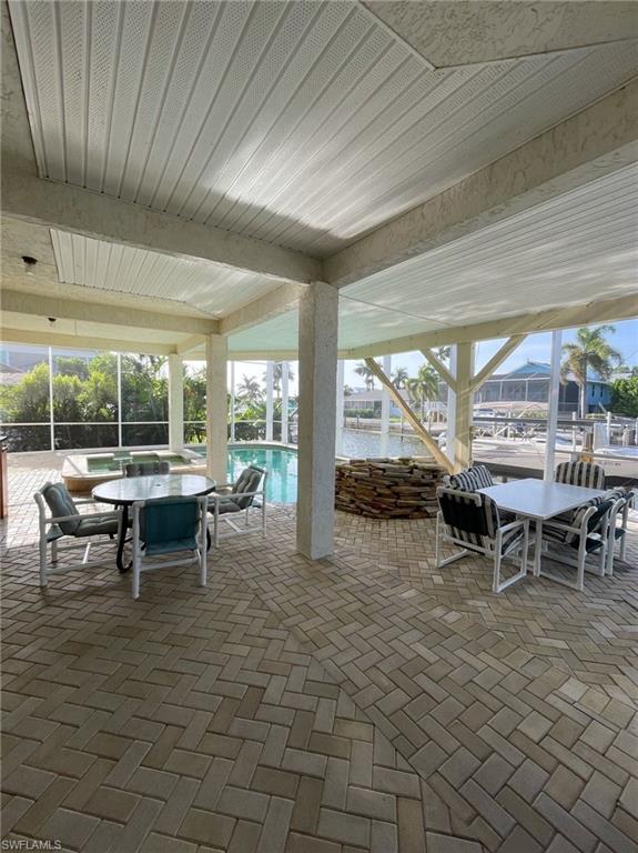405 Cristobal Street Naples, FL 34113 - Photo 8 of 24 a view of outdoor space with seating