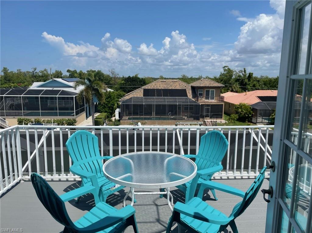 405 Cristobal Street Naples, FL 34113 - Photo 9 of 24 a view of a chairs and table in patio