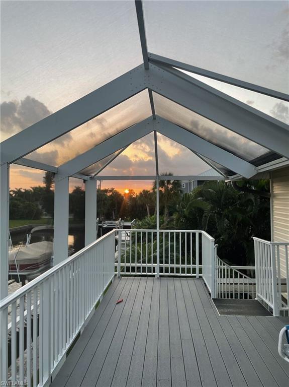 405 Cristobal Street Naples, FL 34113 - Photo 10 of 24 a porch with wooden floor in outdoor space