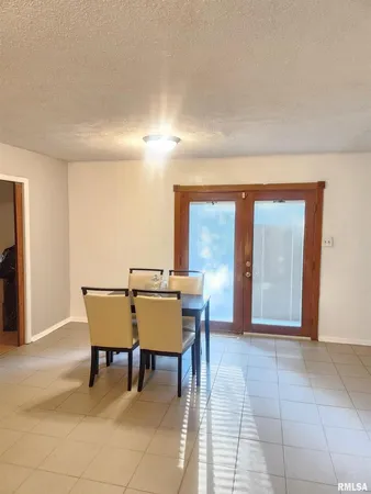 a view of a livingroom with furniture window and wooden floor