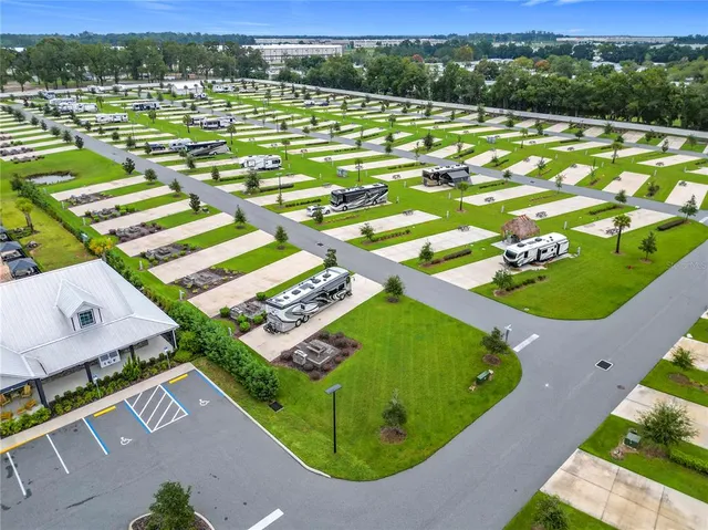 an aerial view of a pool a yard and swimming pool