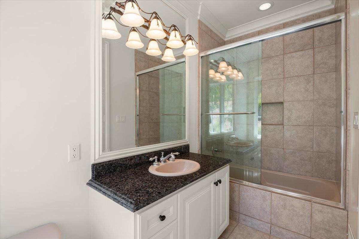 14113 Pike Road Saratoga, CA 95070 - Photo 35 of 78 a bathroom with a sink vanity granite and a mirror