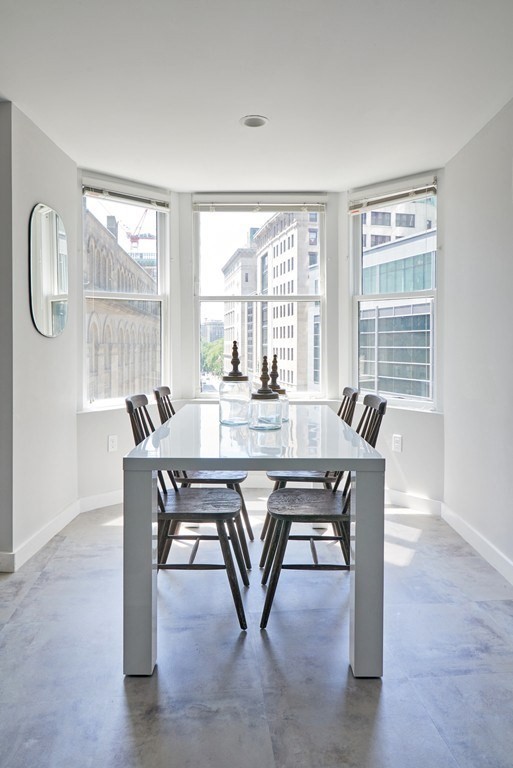 a dining room with furniture and window