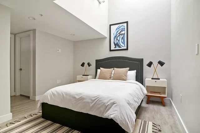 a bedroom with a bed and a walk in closet