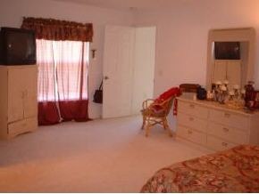223 Northwest Rheine, Unit 48 Palm Bay, FL 32907 - Photo 5 of 10 a living room with furniture and a window