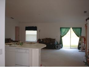 223 Northwest Rheine, Unit 48 Palm Bay, FL 32907 - Photo 10 of 10 a living room with furniture and a large window