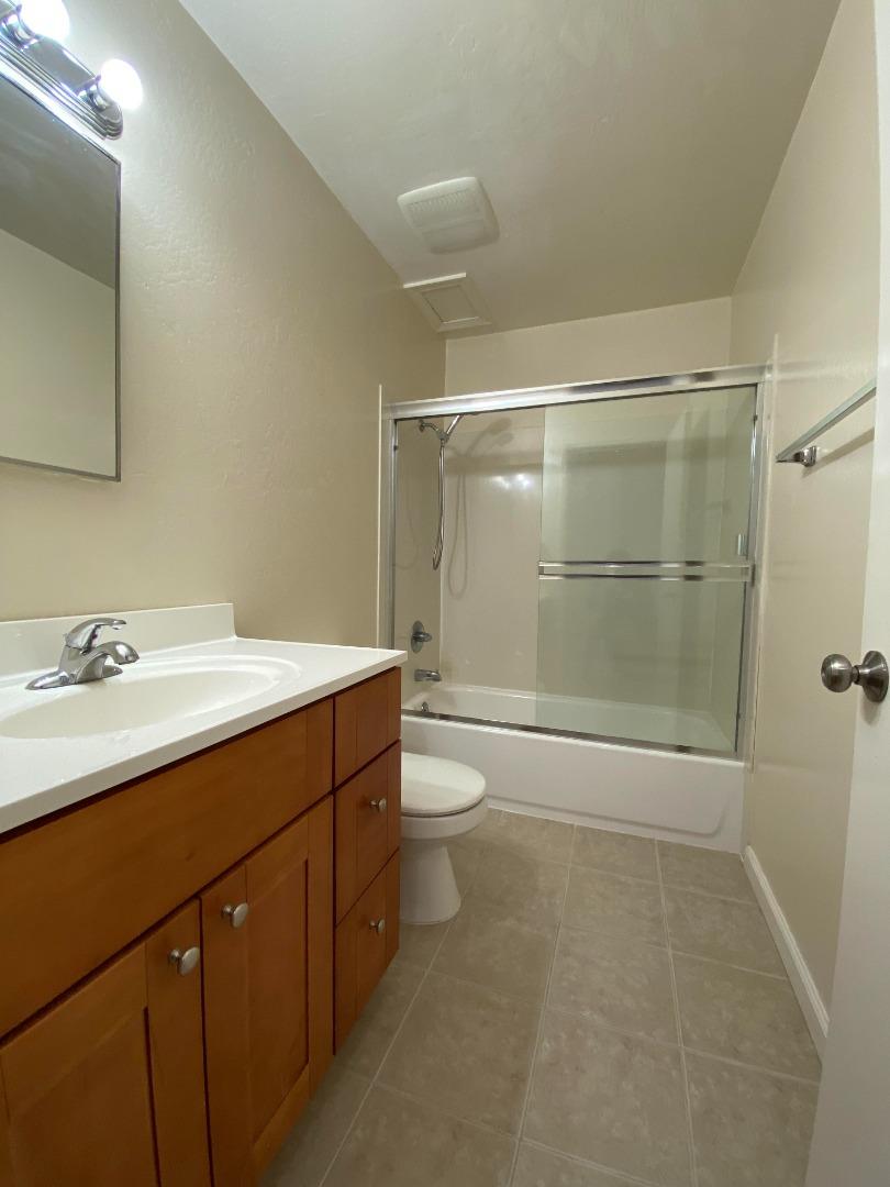 1242 Cortez Drive Sunnyvale, CA 94086 - Photo 11 of 31 a bathroom with a shower sink vanity and toilet