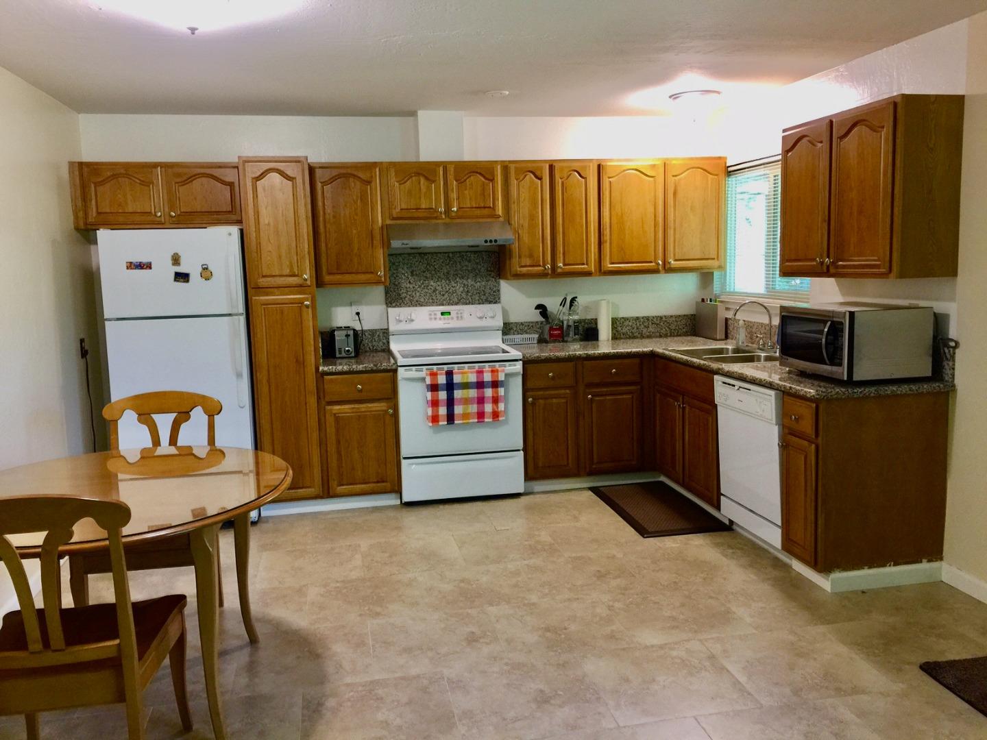 1242 Cortez Drive Sunnyvale, CA 94086 - Photo 25 of 31 a kitchen with stainless steel appliances granite countertop a stove top oven a sink and dishwasher