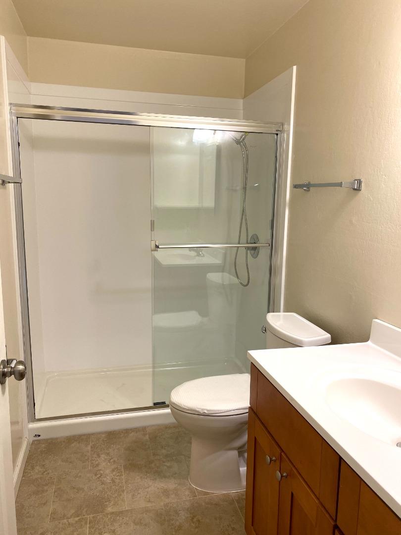1242 Cortez Drive Sunnyvale, CA 94086 - Photo 27 of 31 a bathroom with a granite countertop shower toilet and sink