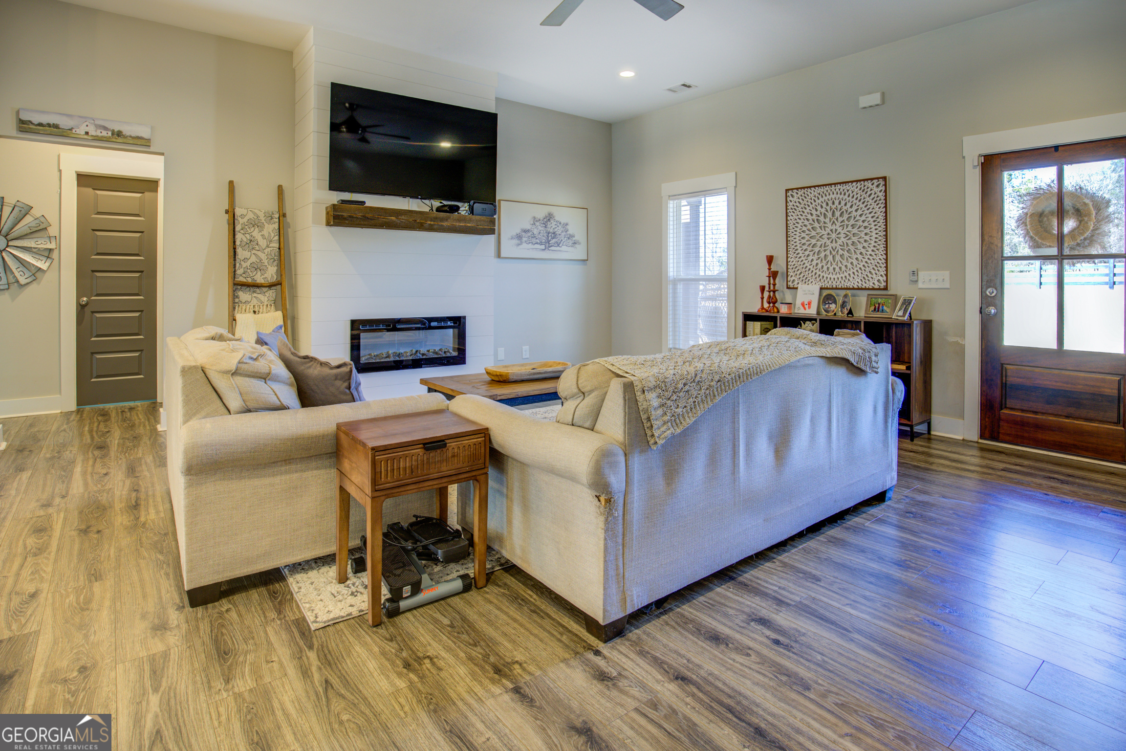 3320 Davis Academy Road Rutledge, GA 30663 - Photo 18 of 45 a living room with a bed furniture and a flat screen tv