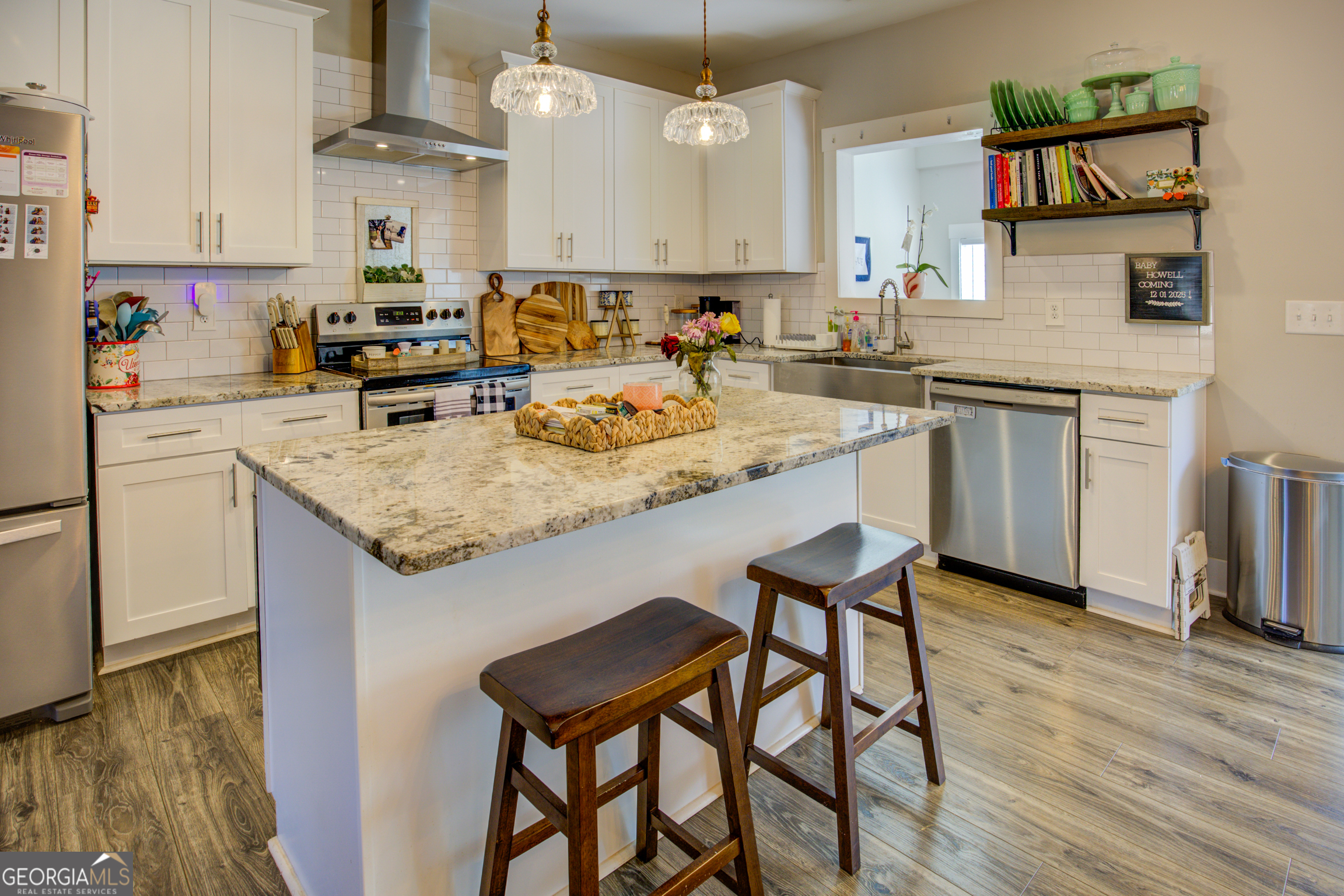 3320 Davis Academy Road Rutledge, GA 30663 - Photo 20 of 45 a kitchen with a sink cabinets and wooden floor