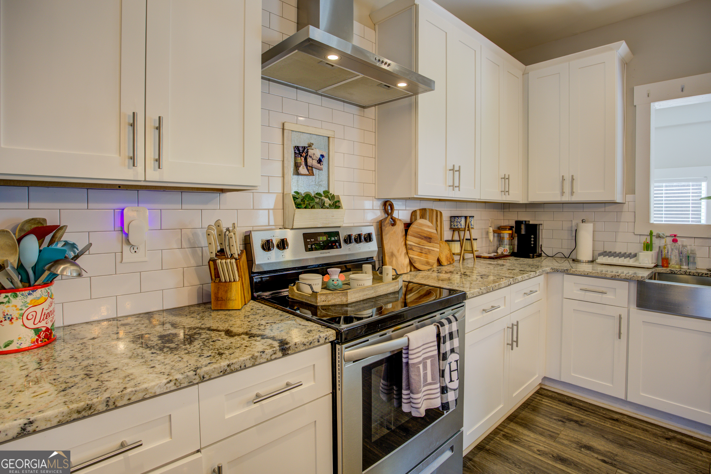3320 Davis Academy Road Rutledge, GA 30663 - Photo 21 of 45 a kitchen with stainless steel appliances granite countertop a sink stove and cabinets