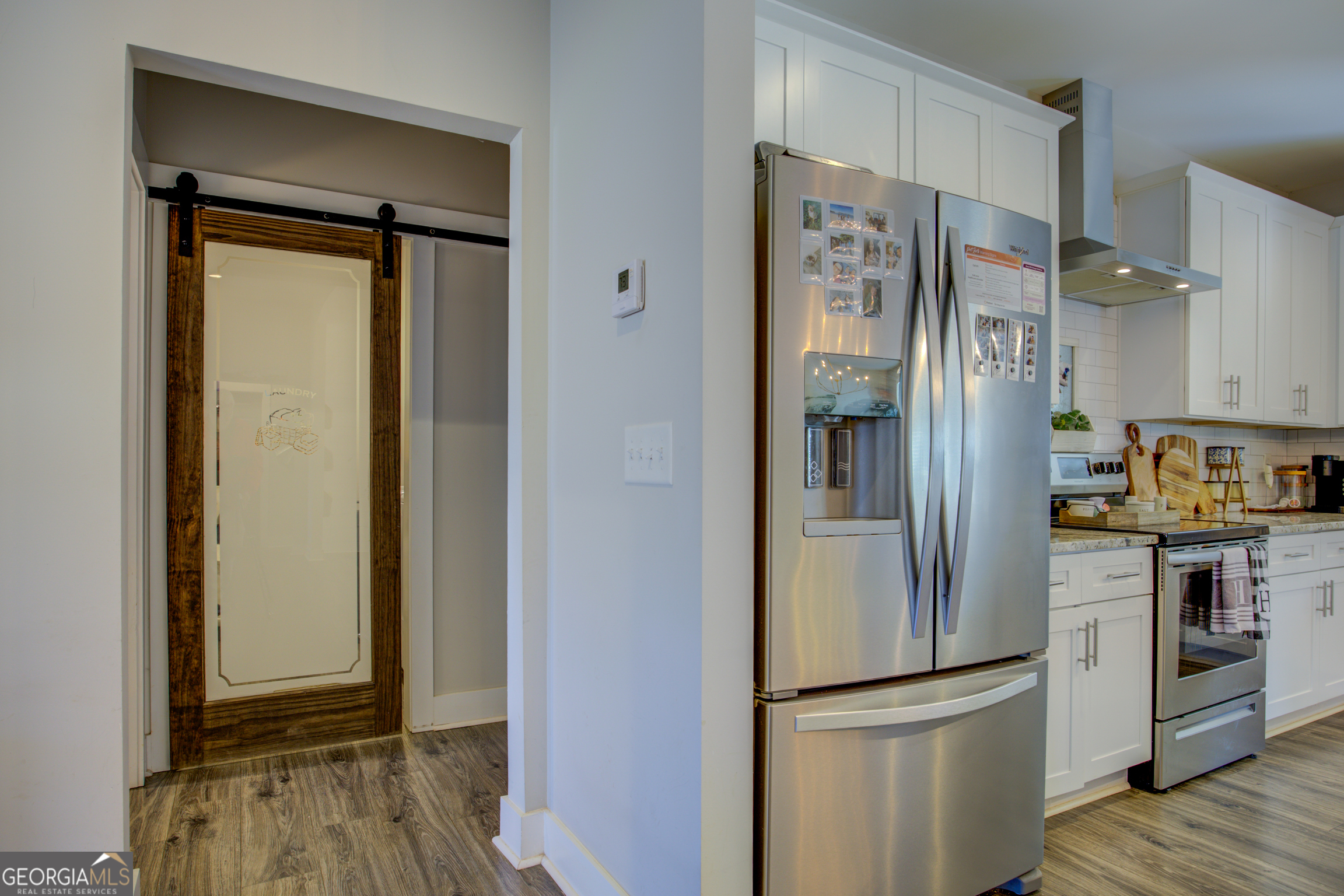 3320 Davis Academy Road Rutledge, GA 30663 - Photo 22 of 45 a view of a refrigerator in kitchen and wooden floor