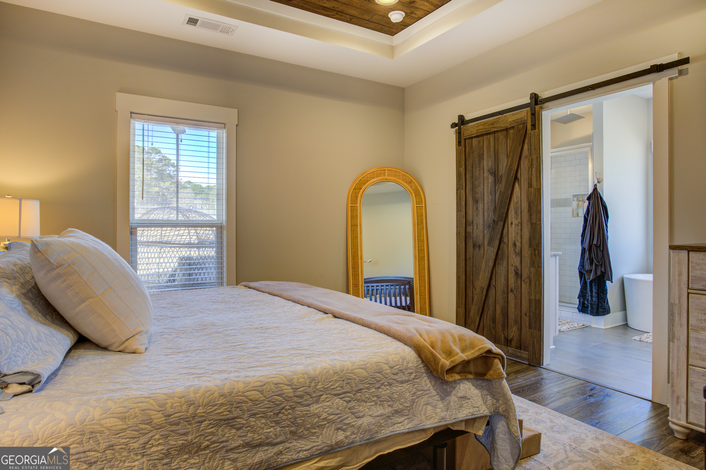 3320 Davis Academy Road Rutledge, GA 30663 - Photo 24 of 45 a bedroom with a bed and a dresser