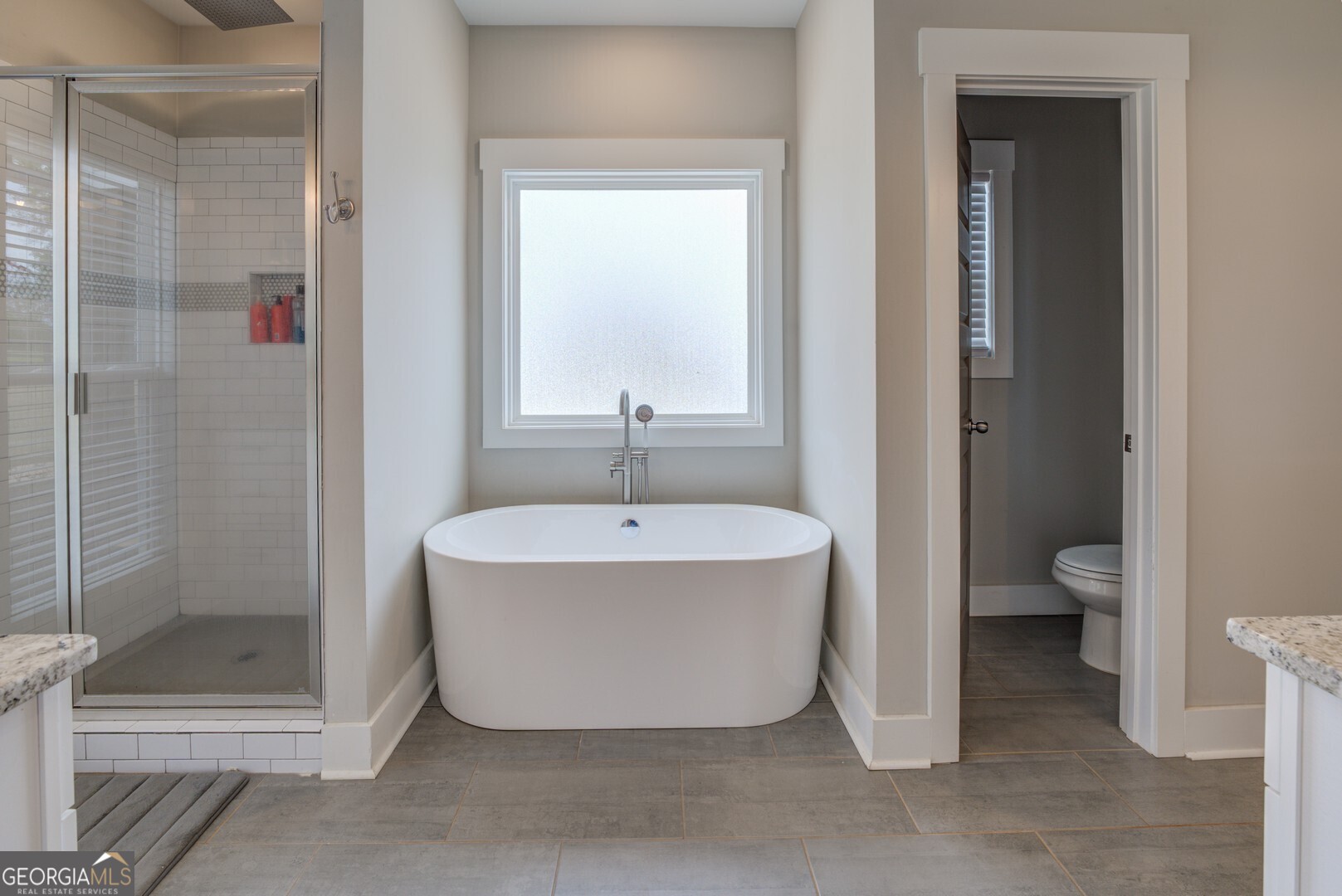 3320 Davis Academy Road Rutledge, GA 30663 - Photo 27 of 45 a spacious bathroom with a bathtub and toilet