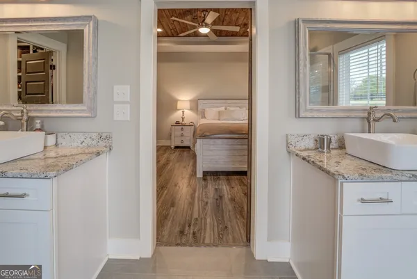 a spacious bathroom with a bathtub and shower