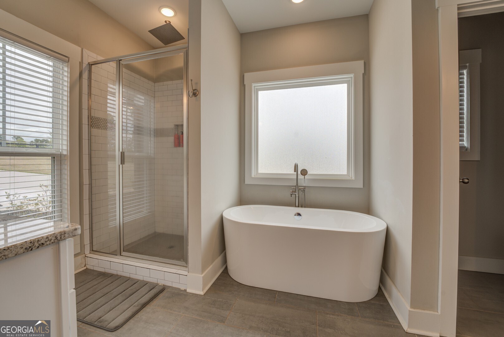 3320 Davis Academy Road Rutledge, GA 30663 - Photo 29 of 45 a spacious bathroom with a bathtub and shower