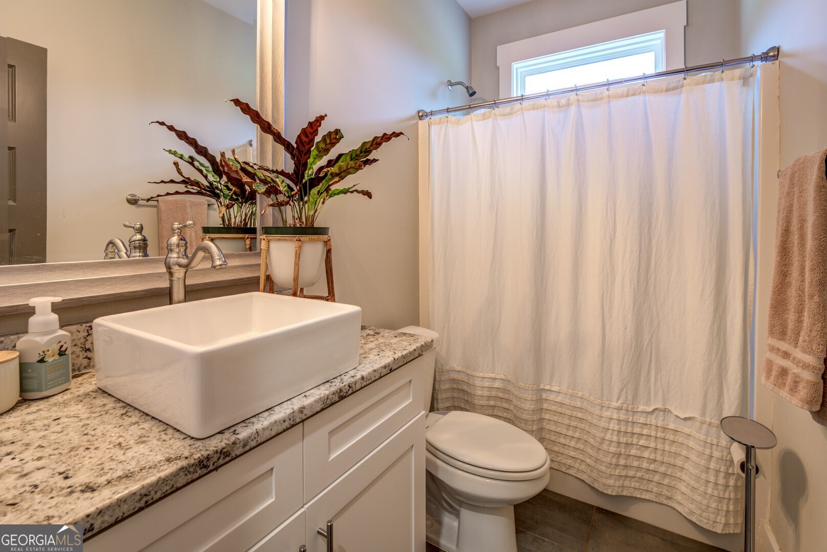 3320 Davis Academy Road Rutledge, GA 30663 - Photo 37 of 45 a bathroom with a sink toilet and shower