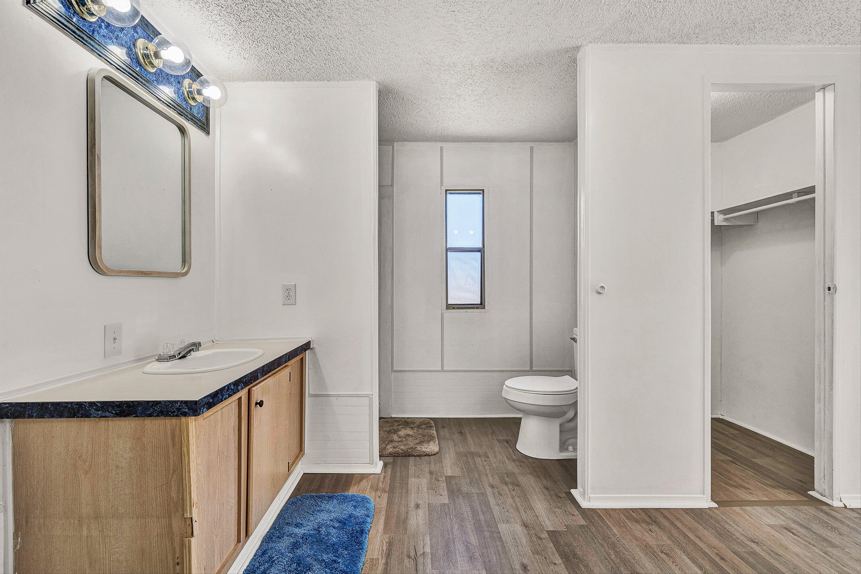 1155 Stonewall Road Blue Ridge, VA 24064 - Photo 12 of 43 a bathroom with a sink a toilet and shower