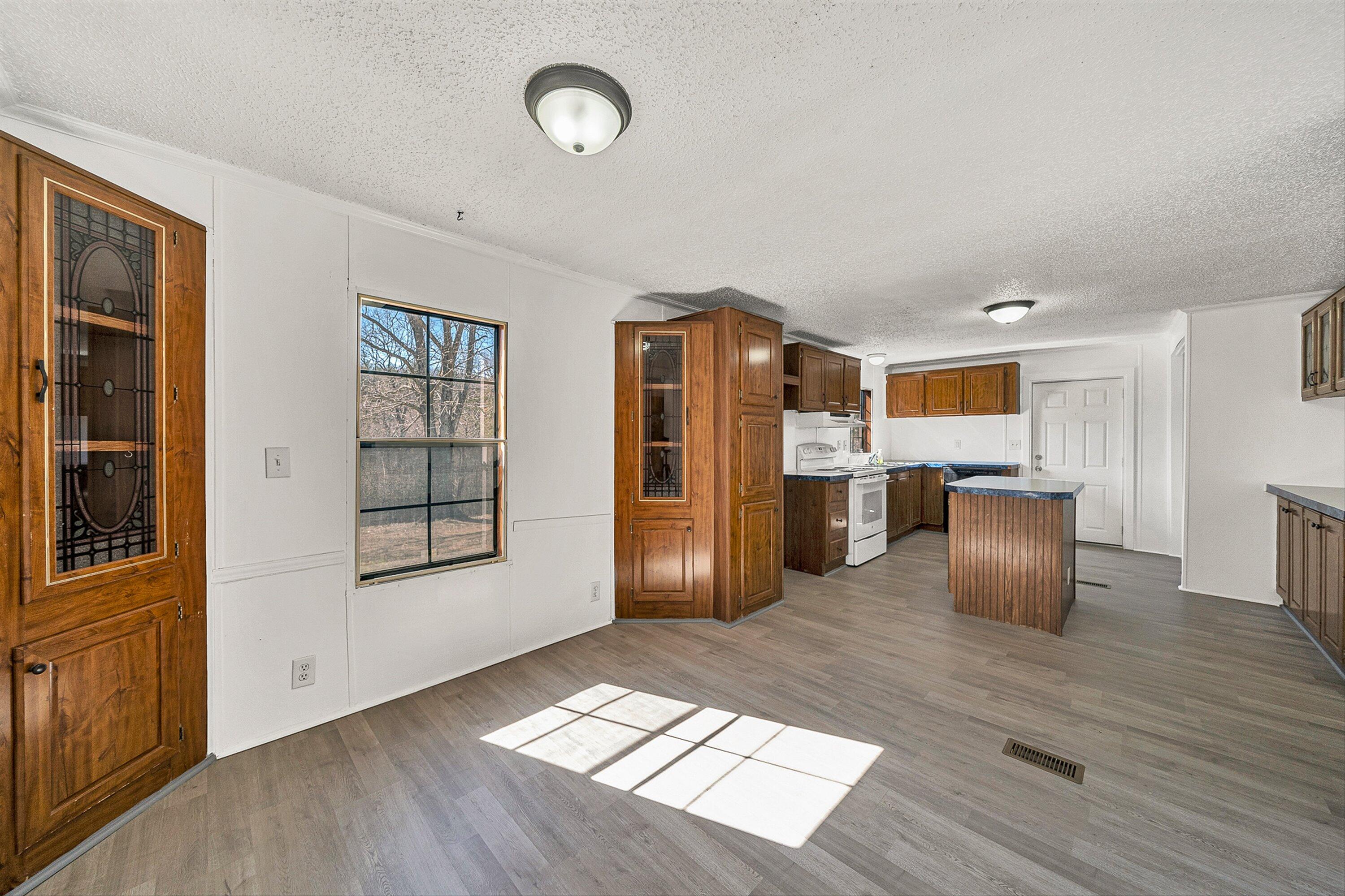 1155 Stonewall Road Blue Ridge, VA 24064 - Photo 15 of 43 a view of kitchen with furniture and wooden floor