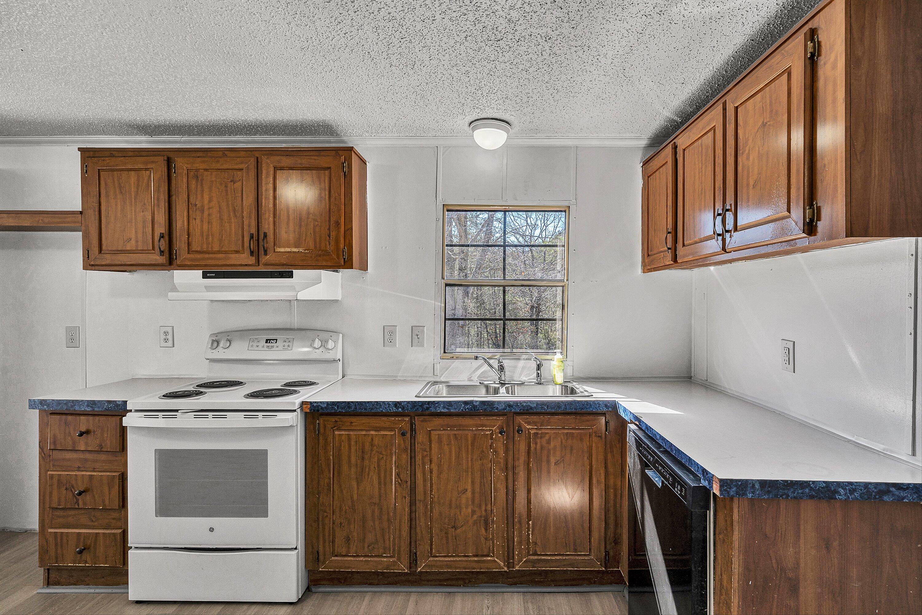 1155 Stonewall Road Blue Ridge, VA 24064 - Photo 18 of 43 a kitchen with a stove and a microwave