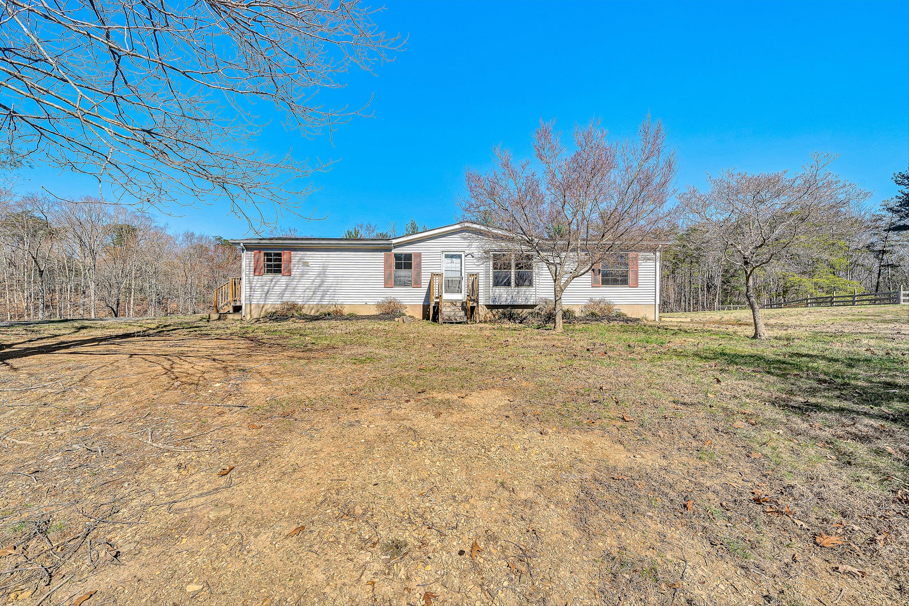 1155 Stonewall Road Blue Ridge, VA 24064 - Photo 3 of 43 a view of a house with a yard