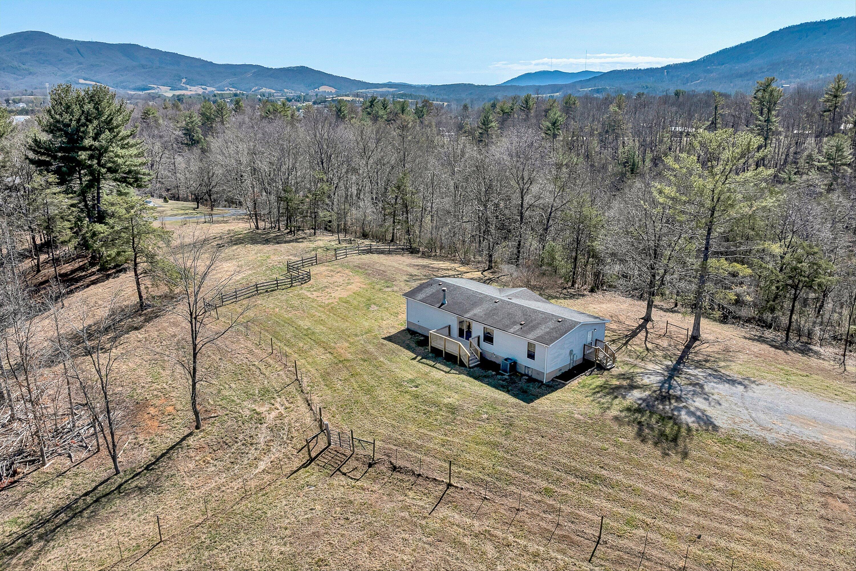 1155 Stonewall Road Blue Ridge, VA 24064 - Photo 39 of 43 a view of a backyard with trees