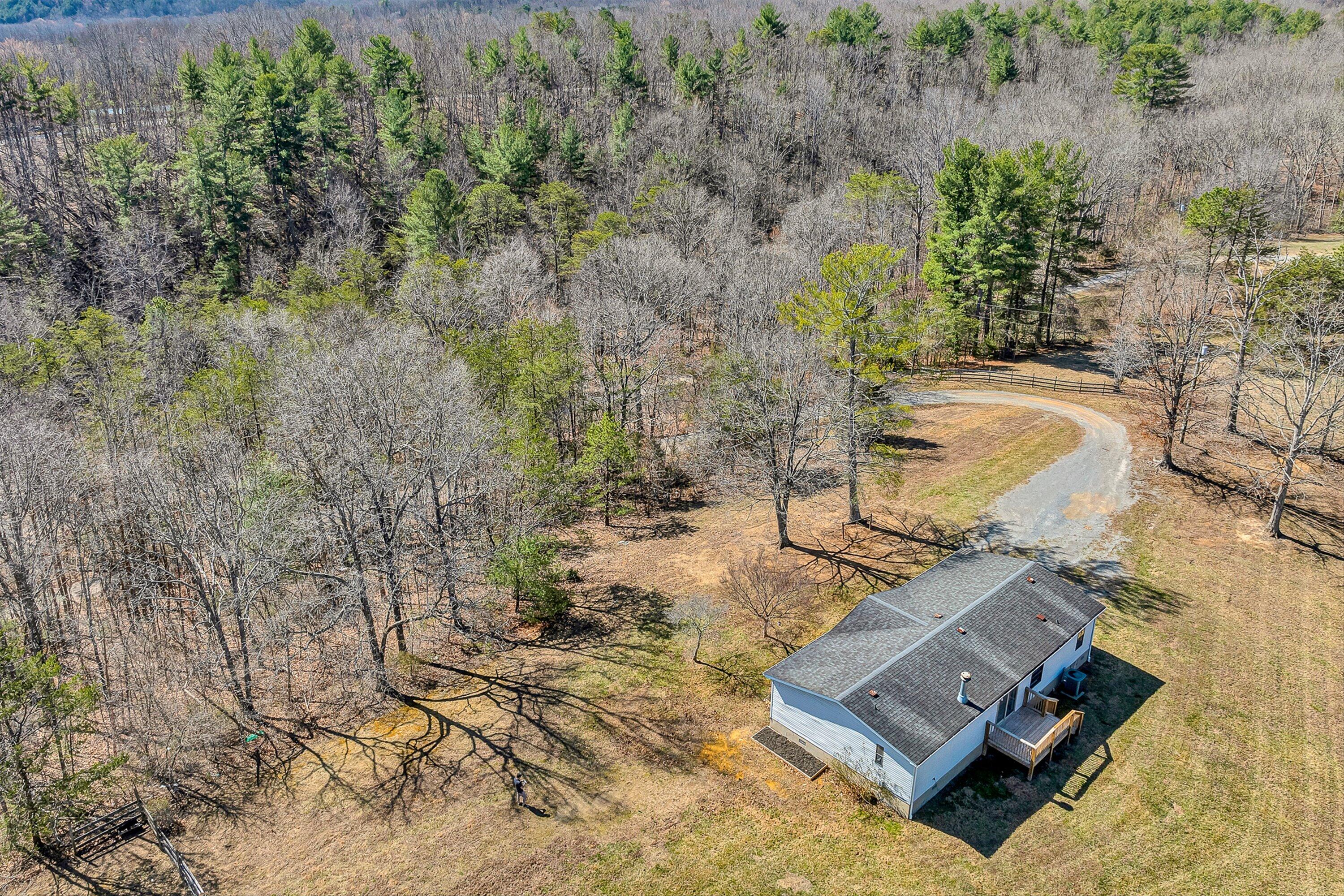 1155 Stonewall Road Blue Ridge, VA 24064 - Photo 42 of 43 a view of a house with a yard