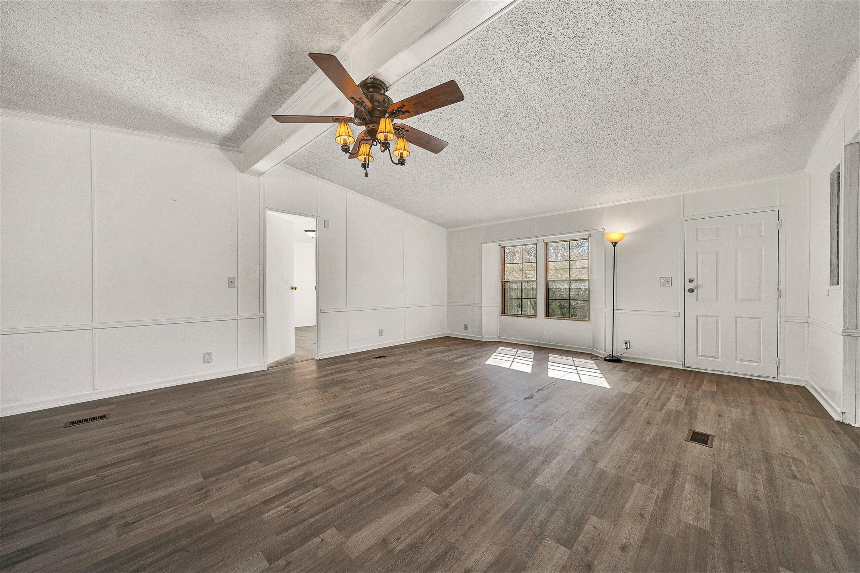 1155 Stonewall Road Blue Ridge, VA 24064 - Photo 5 of 43 wooden floor in an empty room with a window