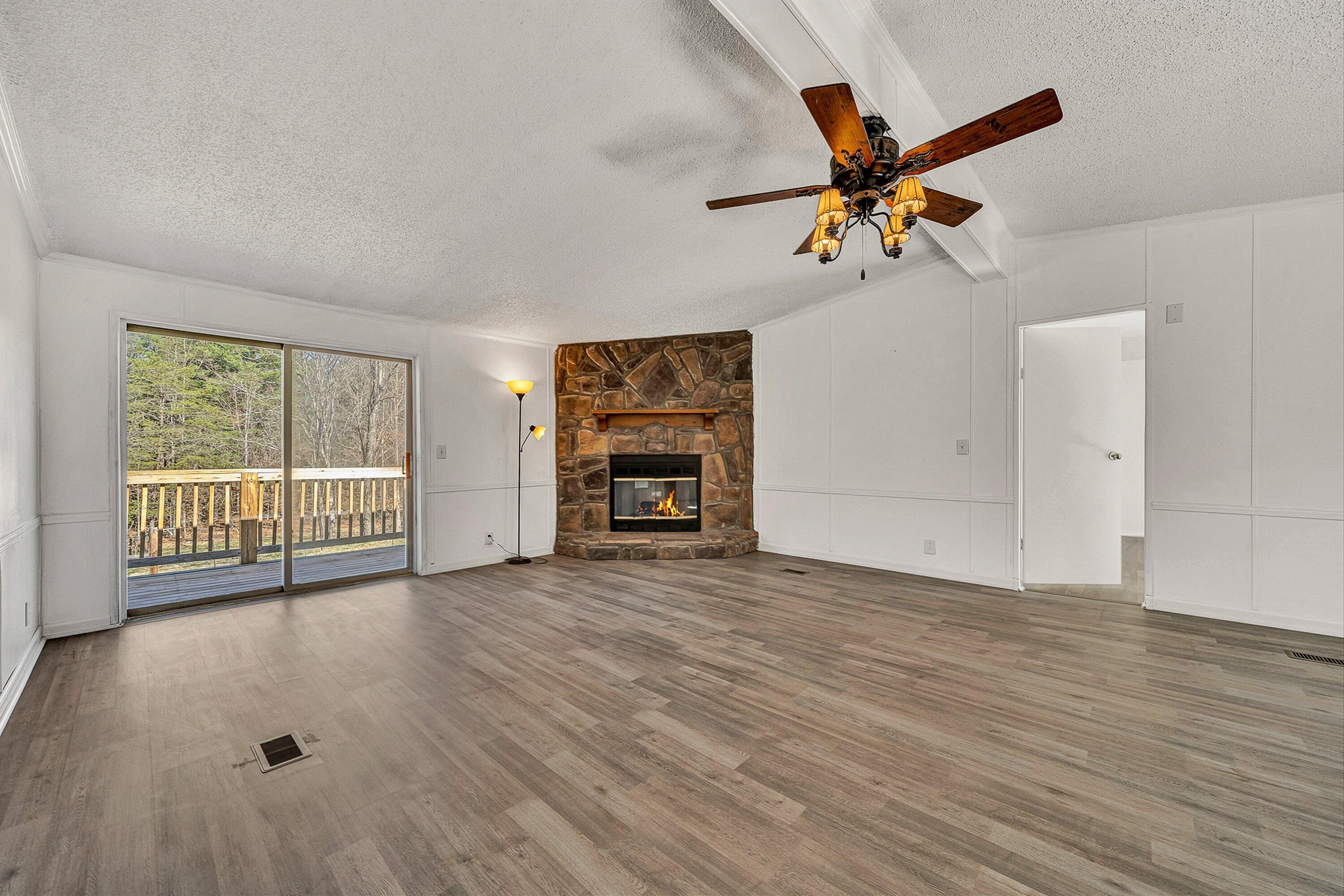 1155 Stonewall Road Blue Ridge, VA 24064 - Photo 7 of 43 wooden floor in an empty room with a window