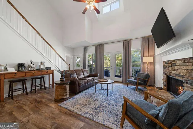 a living room with fireplace furniture and a flat screen tv