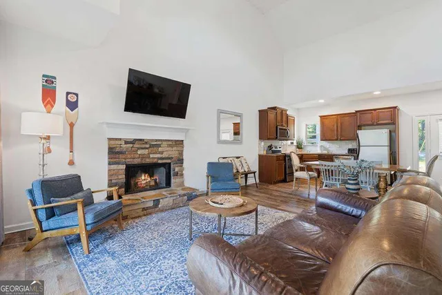 a living room with furniture fireplace and a flat screen tv