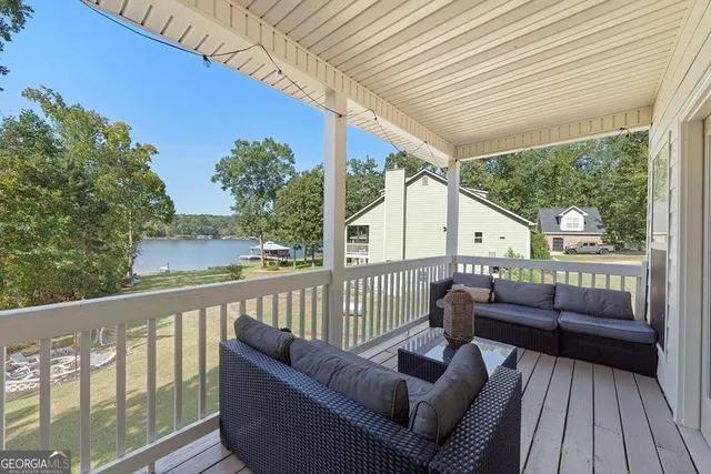 a view of a two chairs in the balcony