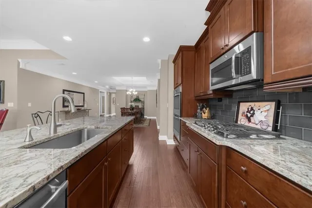 a utility room with sink dryer and washer