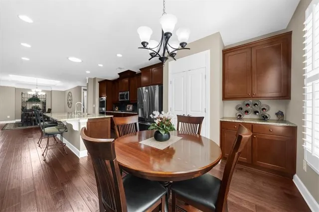 a view of walk in closet with clothes