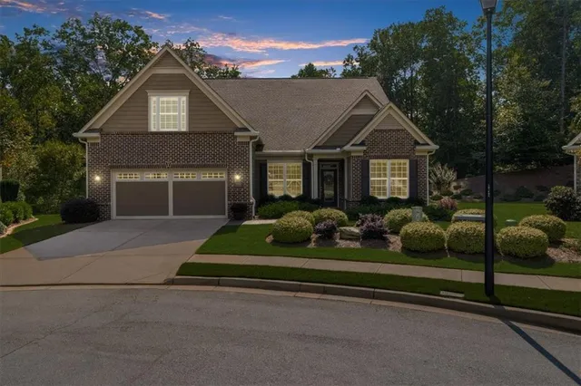 a view of a hallway view with wooden floor and staircase