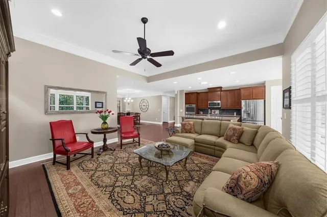 a bed room with a bed and a ceiling fan