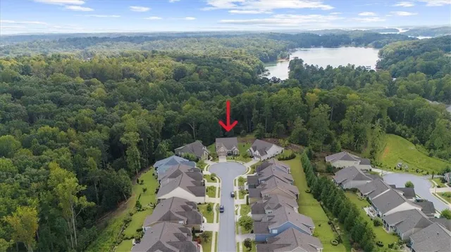 a view of a dining room with furniture a rug and wooden floor