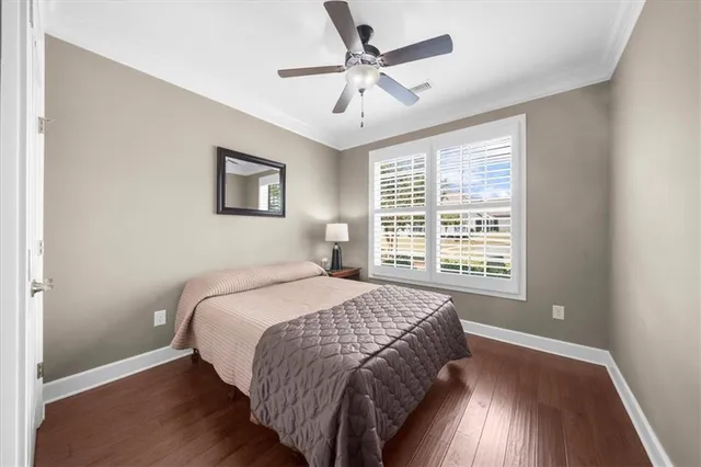 an aerial view of a house with swimming pool and garden