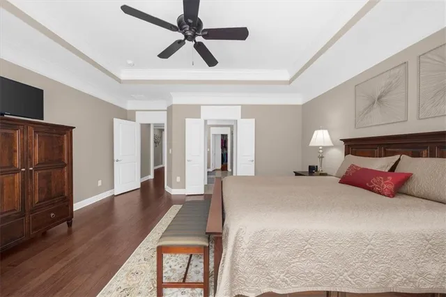an aerial view of a swimming pool with outdoor seating and yard