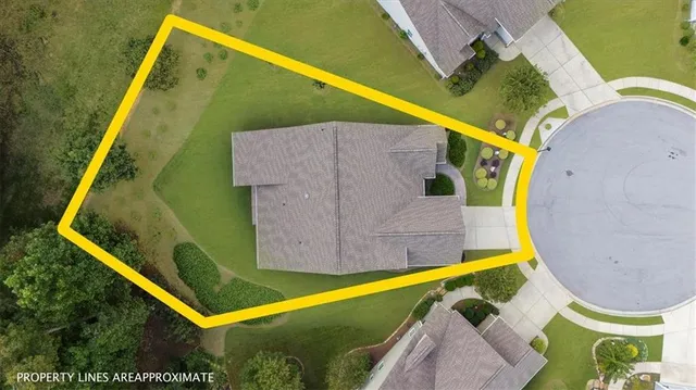 a view of a livingroom with furniture and a flat screen tv