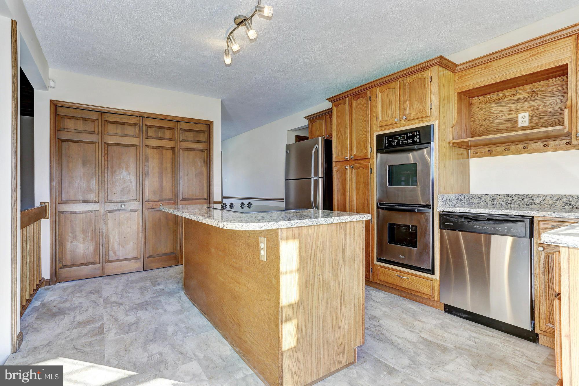 602 Rivershore Court Edgewood, MD 21040 - Photo 7 of 28 a kitchen with stainless steel appliances granite countertop a refrigerator and a stove top oven