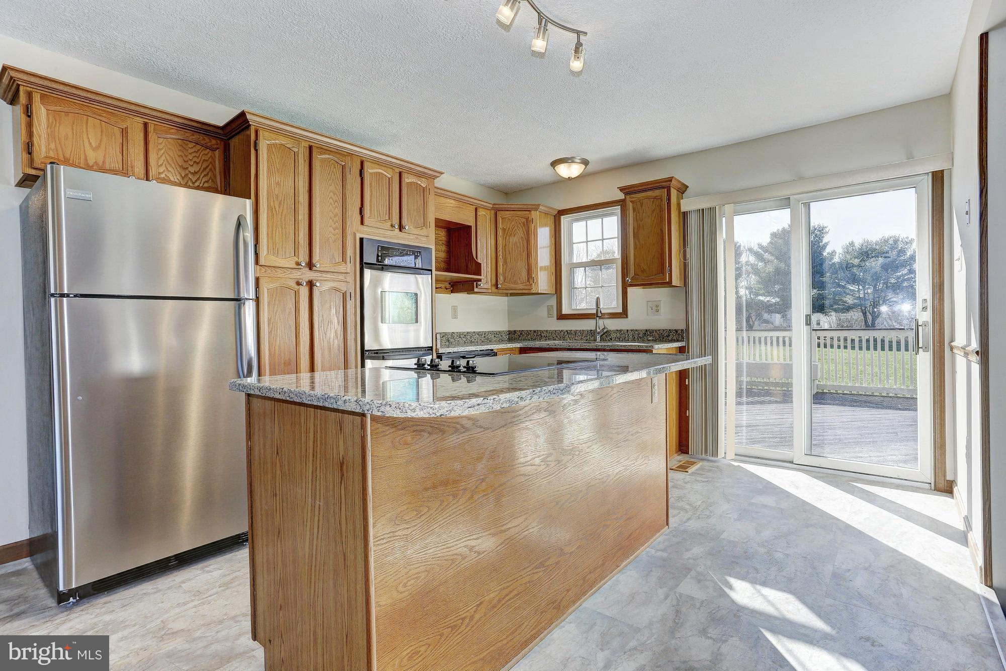 602 Rivershore Court Edgewood, MD 21040 - Photo 8 of 28 a kitchen with stainless steel appliances granite countertop a refrigerator a stove and a sink