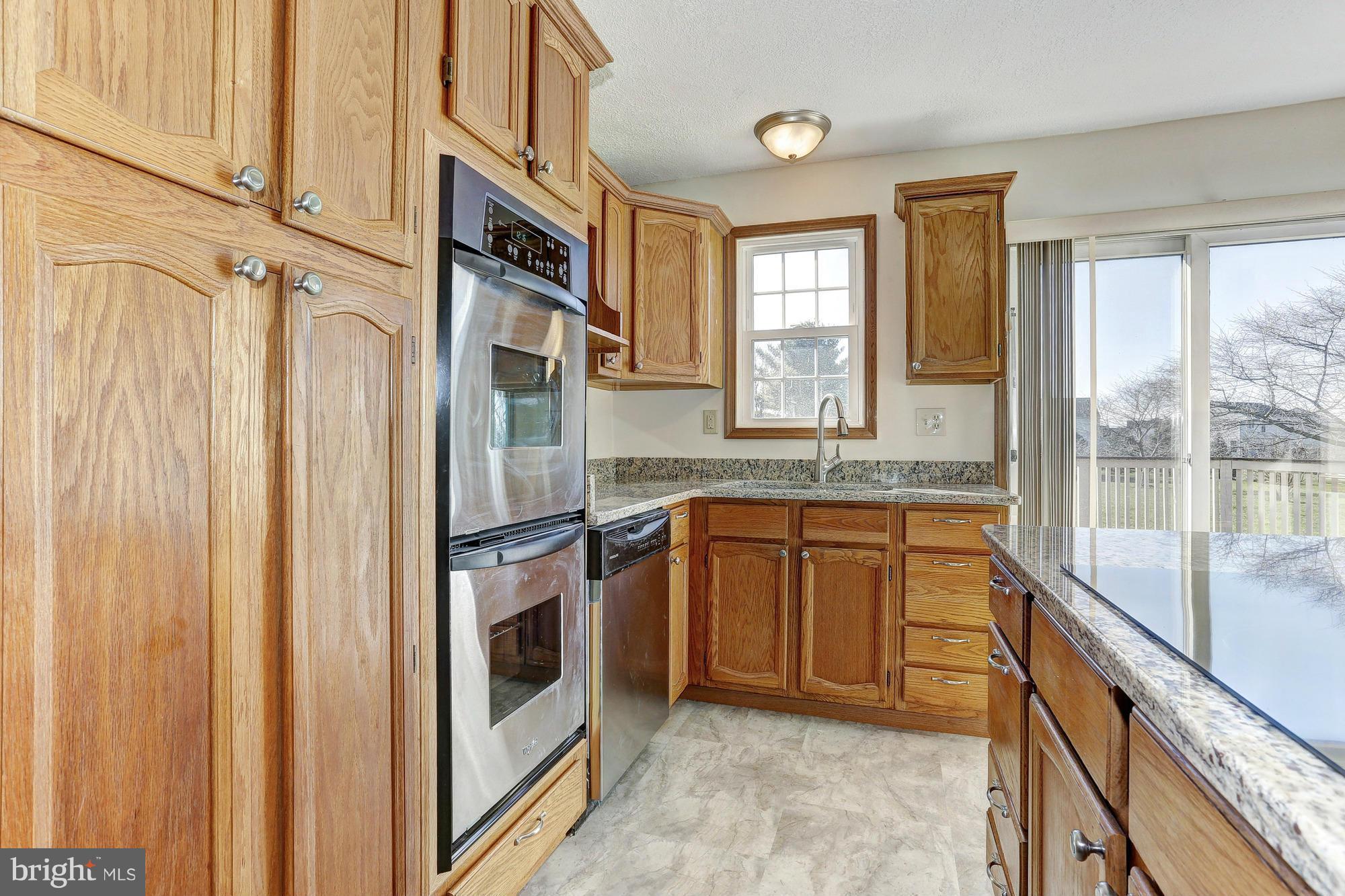 602 Rivershore Court Edgewood, MD 21040 - Photo 9 of 28 a kitchen with stainless steel appliances granite countertop a refrigerator and a sink
