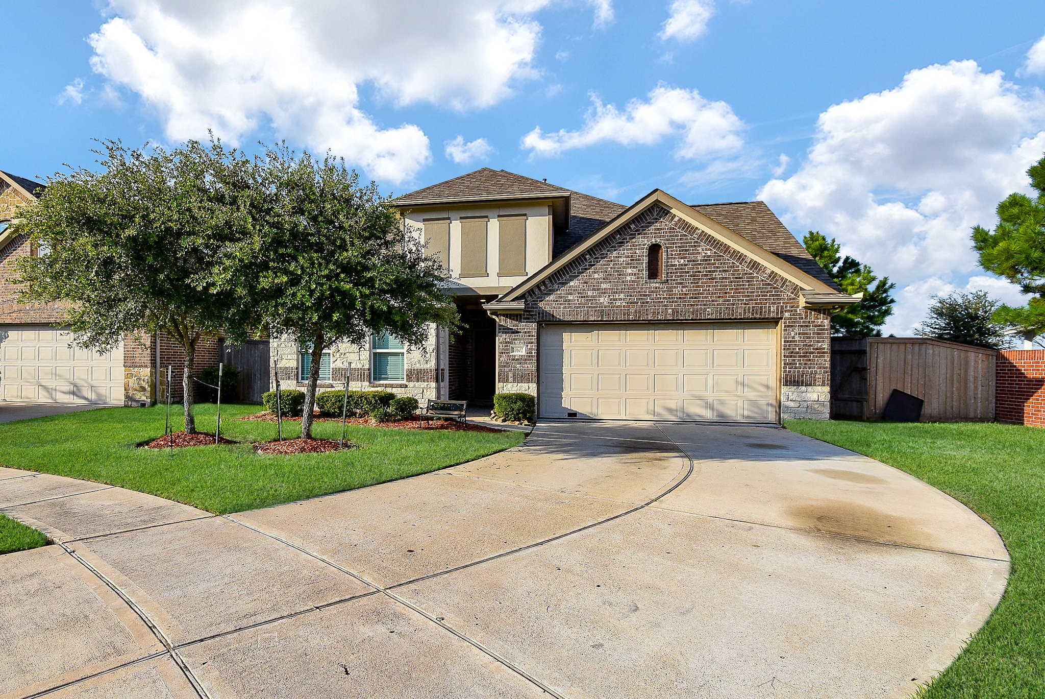 20602 Riley Copper Drive Cypress, TX 77433 - Photo 1 of 32 a front view of a house with a yard and garage