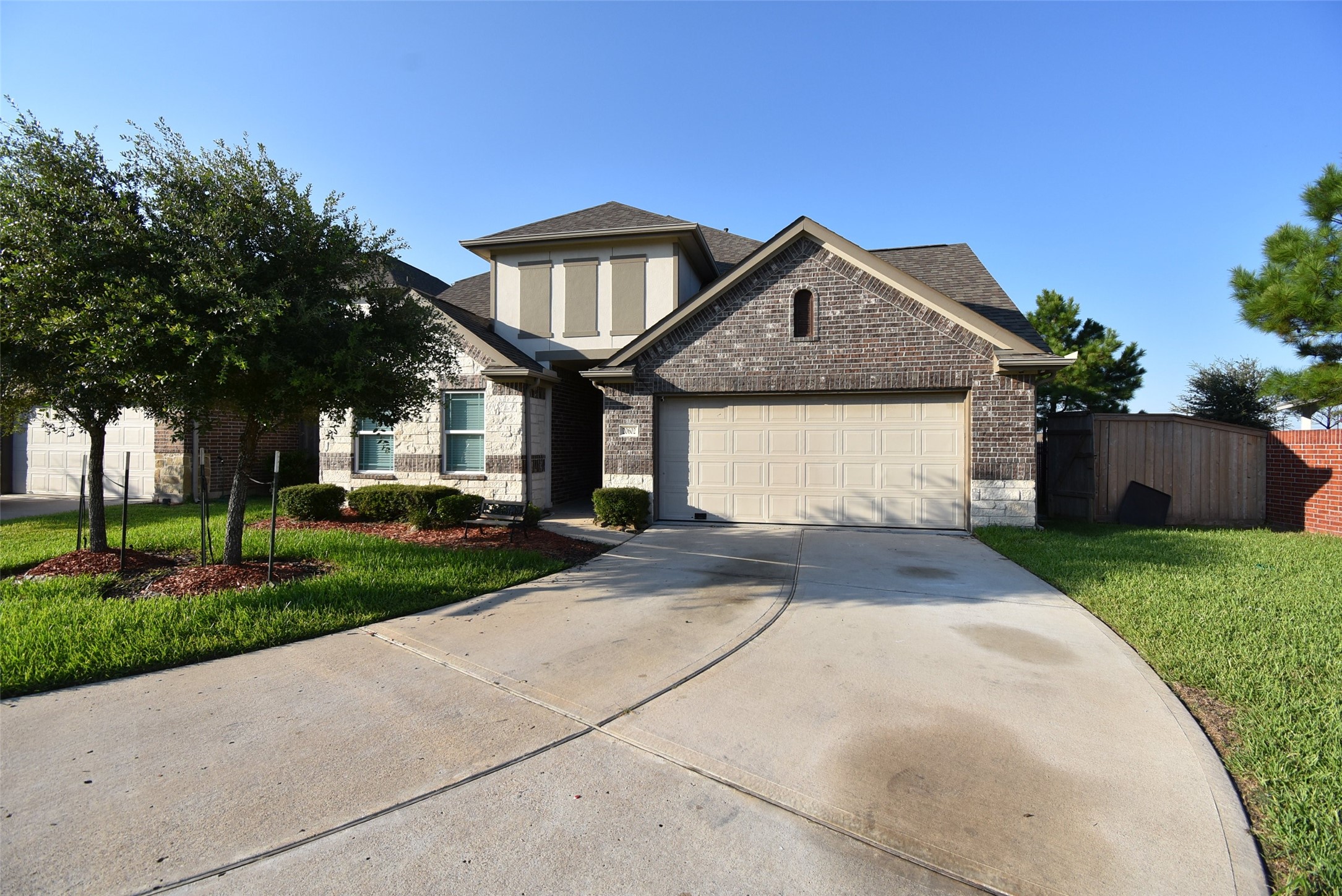 20602 Riley Copper Drive Cypress, TX 77433 - Photo 2 of 32 a front view of a house with a yard and garage
