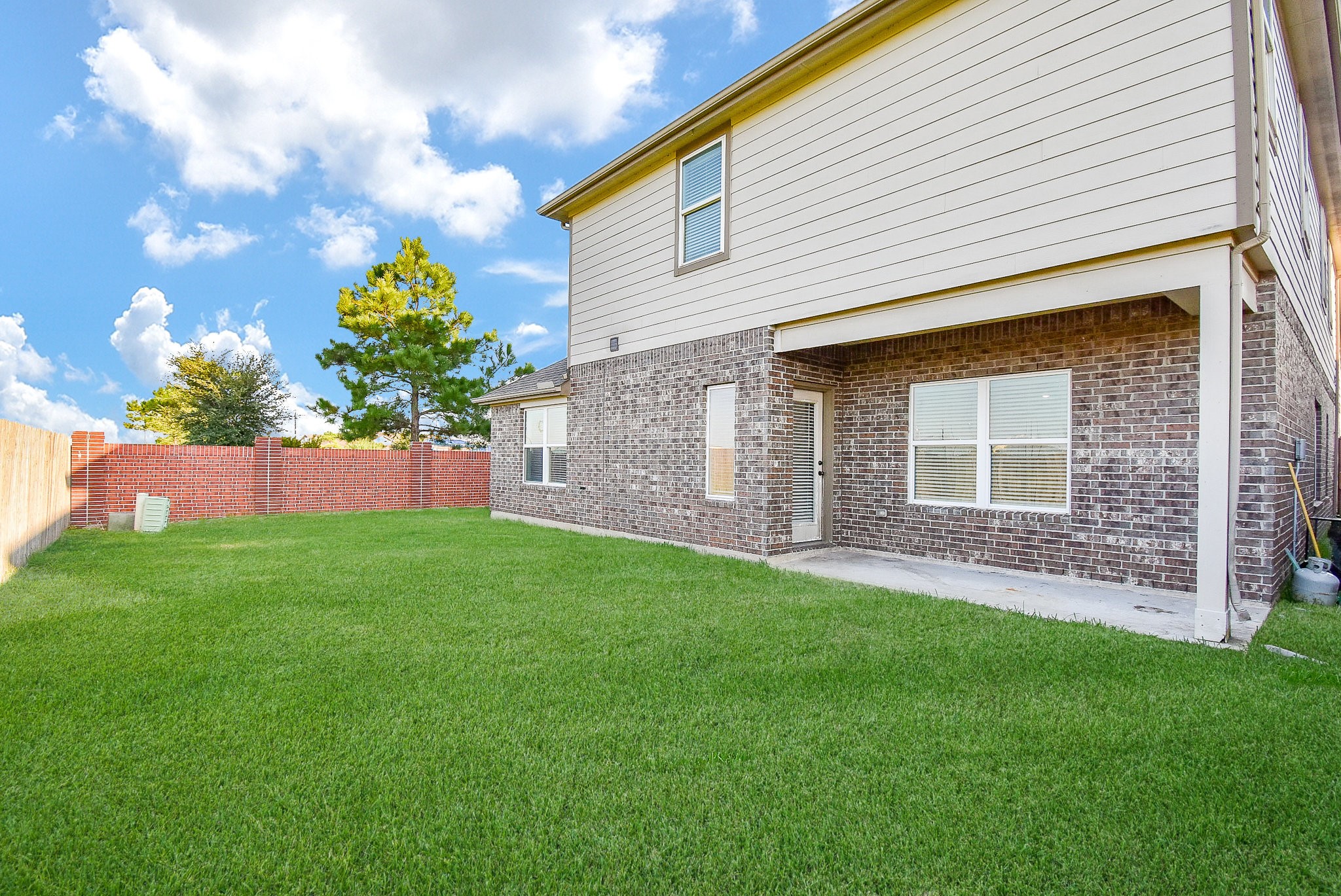 20602 Riley Copper Drive Cypress, TX 77433 - Photo 28 of 32 a front view of a house with a garden