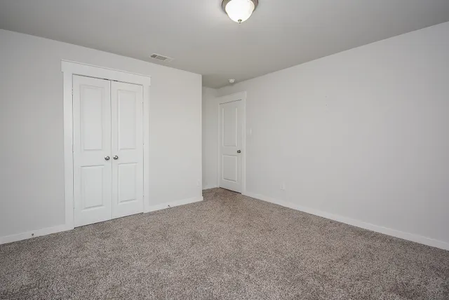 a kitchen with stainless steel appliances granite countertop a sink refrigerator and microwave