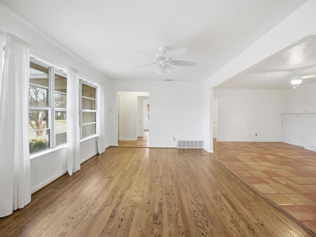 514 West Ridgewood Drive Garland, TX 75041 - Photo 17 of 39 wooden floor in an empty room with a window