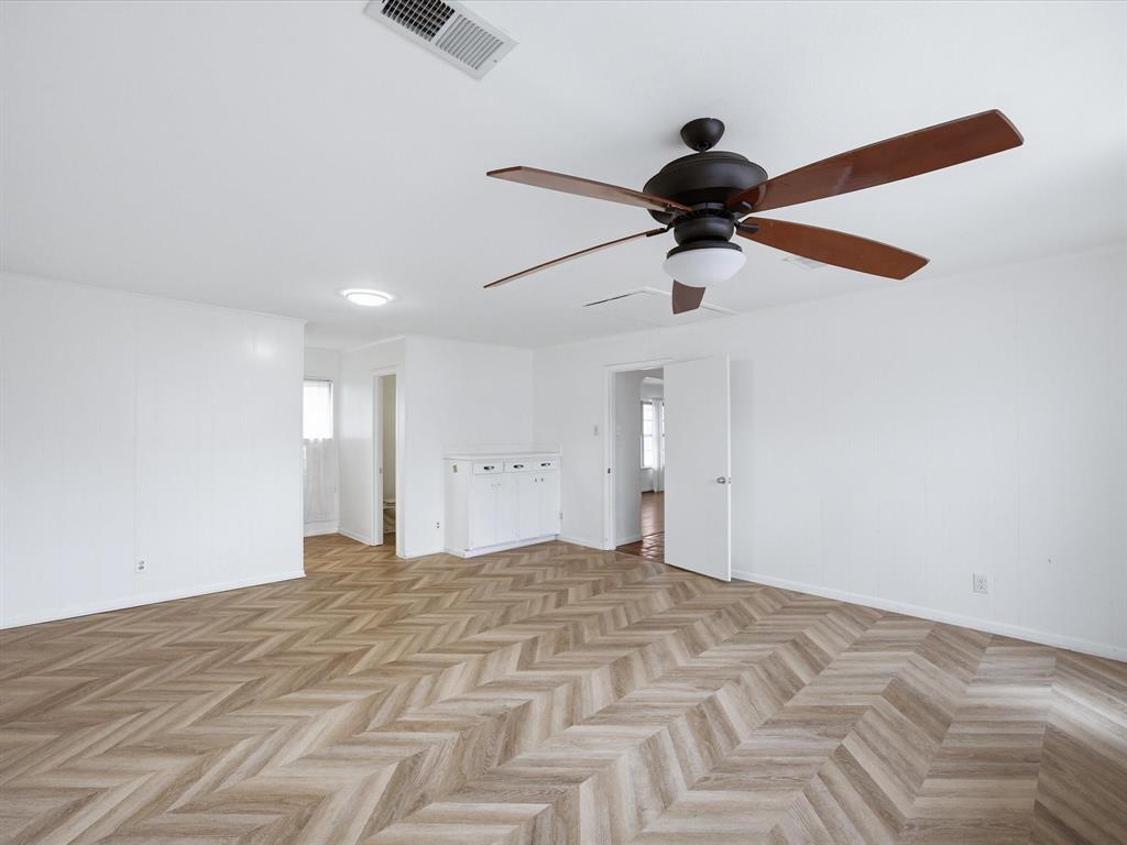 514 West Ridgewood Drive Garland, TX 75041 - Photo 19 of 39 a view of empty room with wooden floor